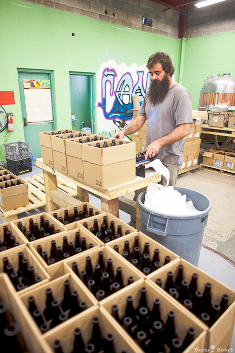 COAST Brewer/Owner, David Merritt Labeling Bottles